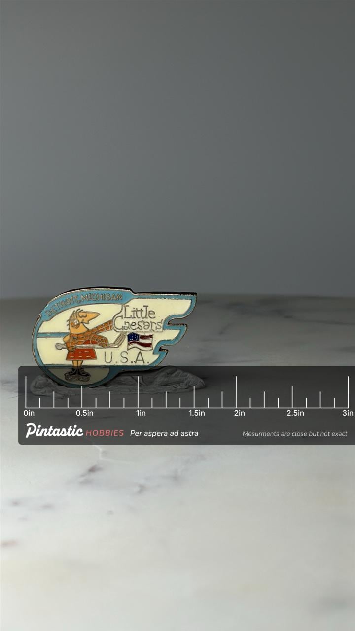 Vintage Detroit Michigan Little Caesars Pin: Enamel Winged Logo - USA Hockey with ruler overlay for size reference
