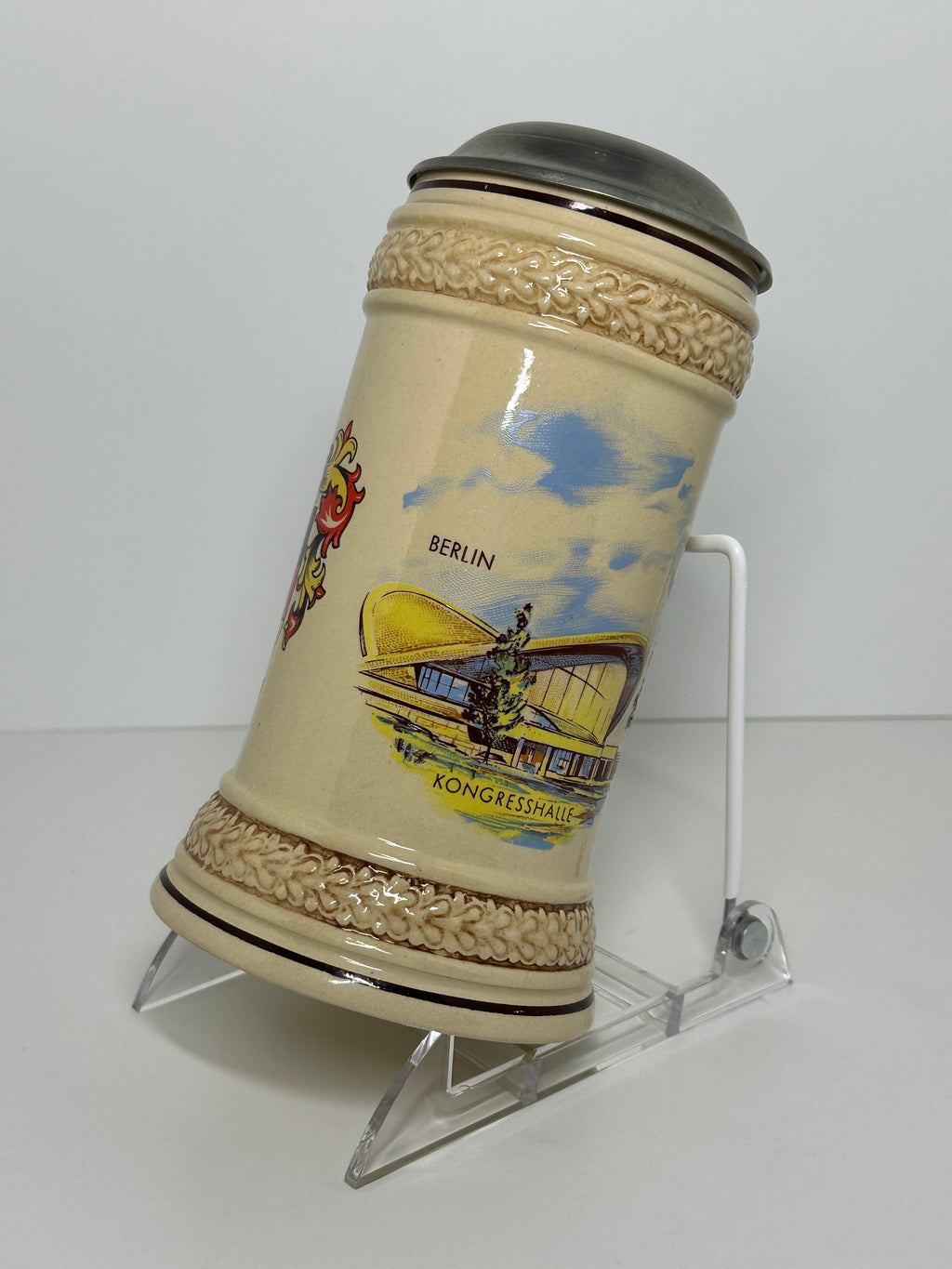 German beer stein with lid featuring Berlin Kongresshalle and Germany crest design