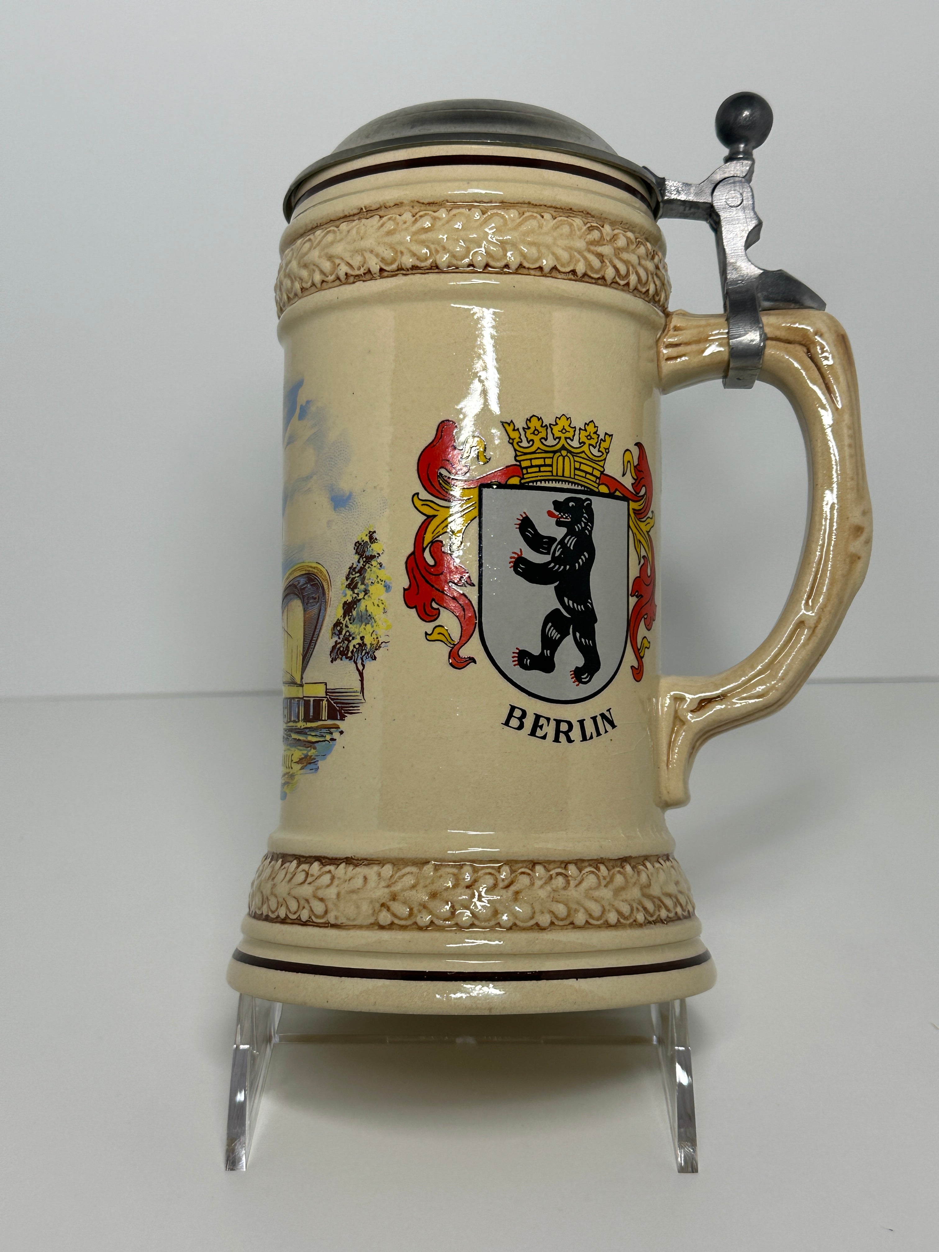 German beer stein with lid featuring Berlin Kongresshalle and Germany crest design