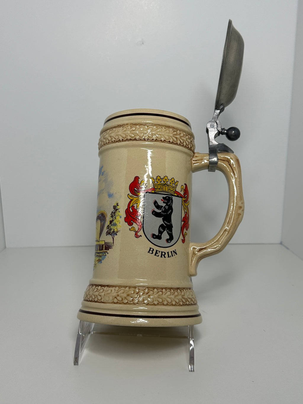 German beer stein with lid featuring Berlin Kongresshalle and Germany crest design