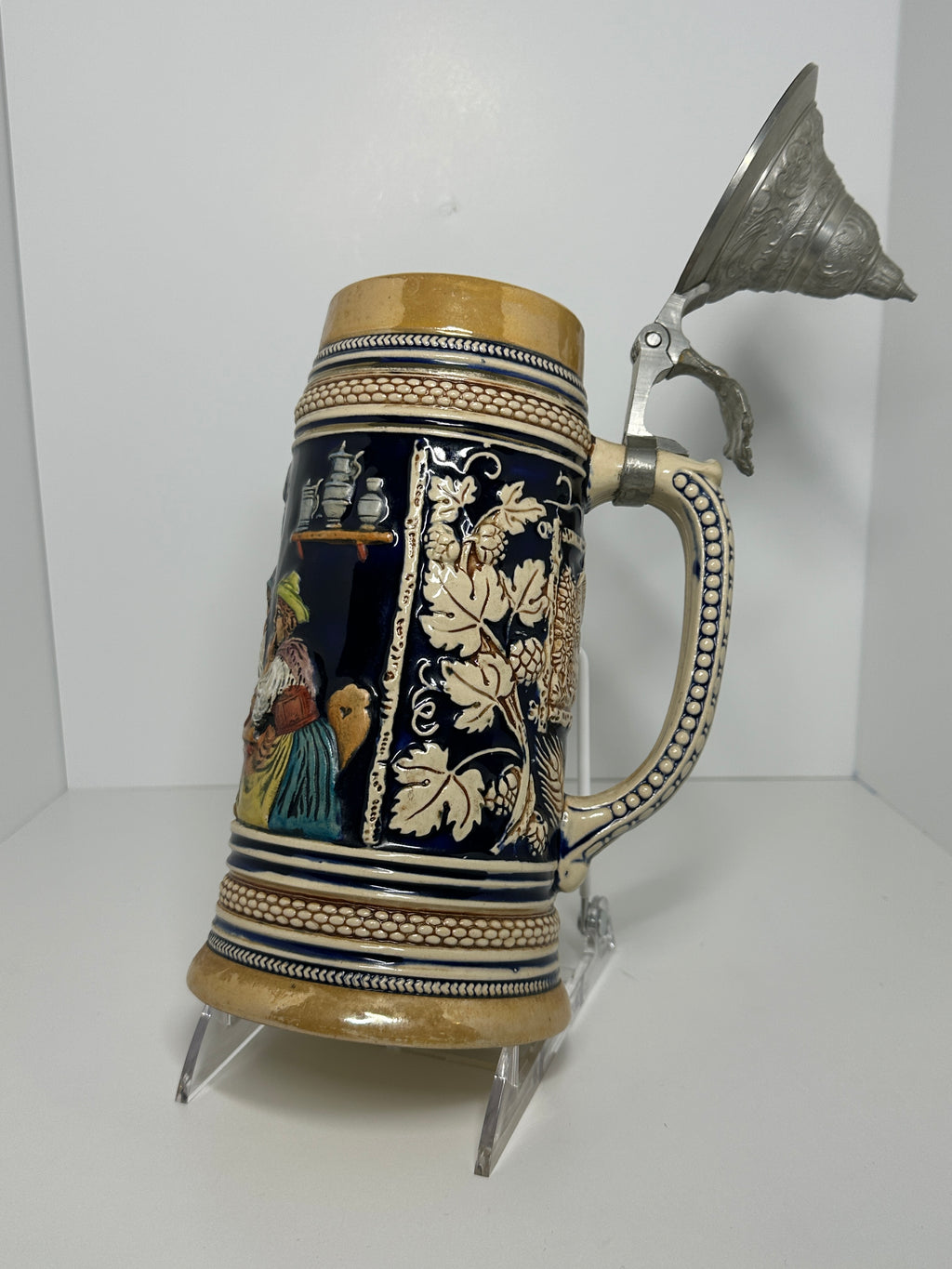 German decorative beer stein with pewter lid, blue and tan raised relief village design, marked 160