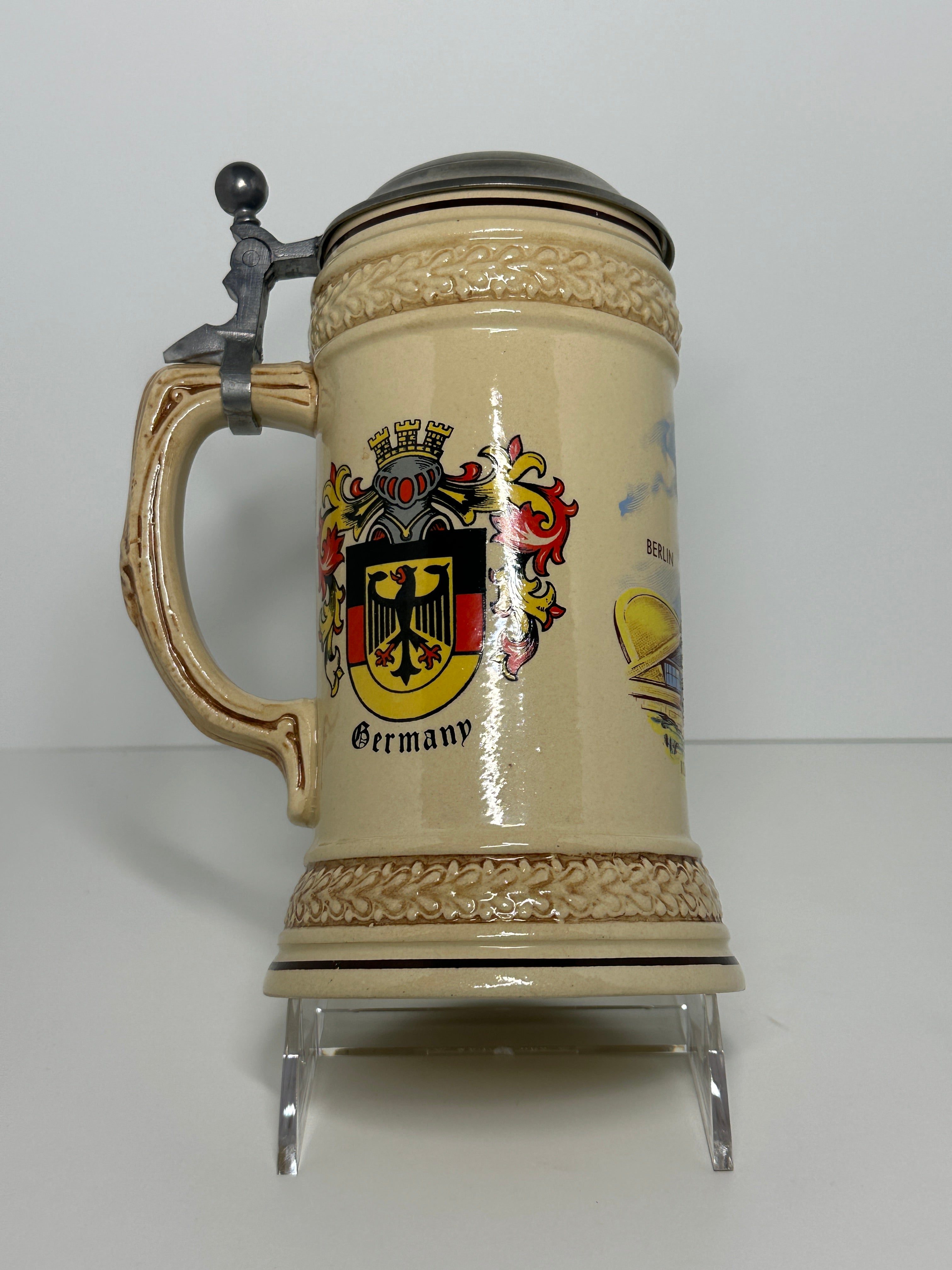 German beer stein with lid featuring Berlin Kongresshalle and Germany crest design