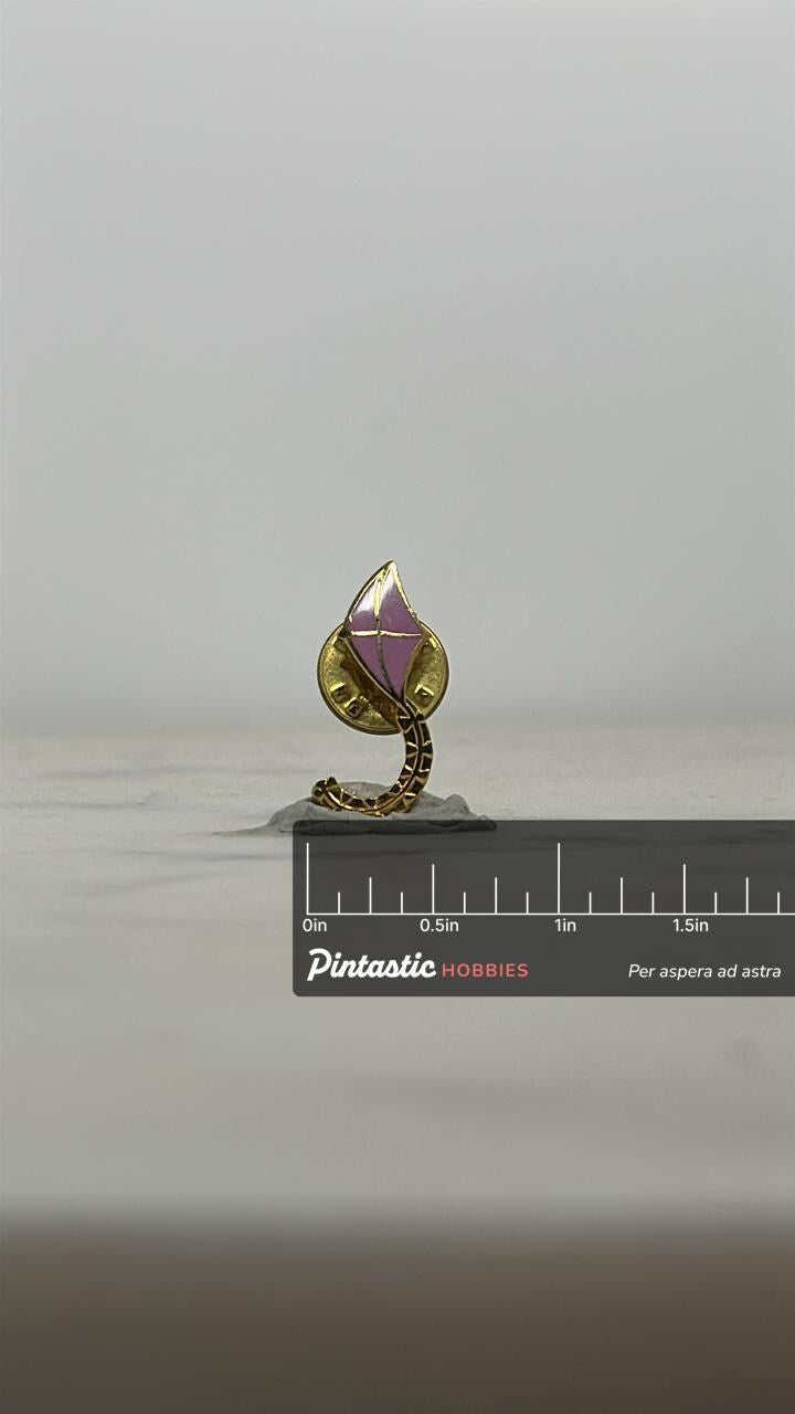 Kite Tail Enamel Pin: Gold & Pink Cloisonné - Whimsical Vintage Accessory with ruler overlay for size reference