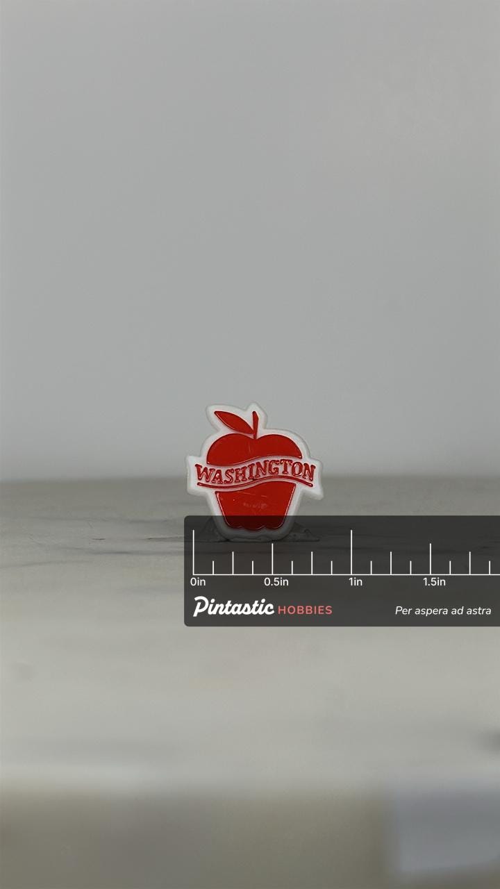 Washington Apple Souvenir Pin: Red & White Enamel - Vintage Travel Accessory with ruler overlay for size reference