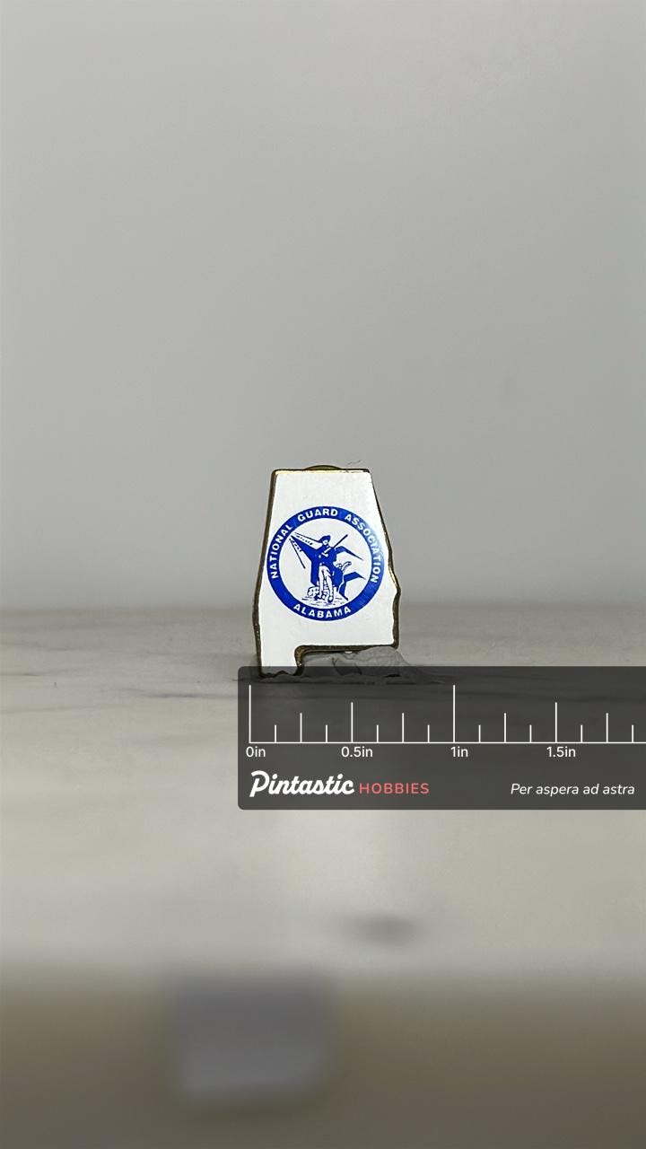 Alabama National Guard Pin: White Enamel Gold Trim - Military Collectible Accessory with ruler overlay for size reference