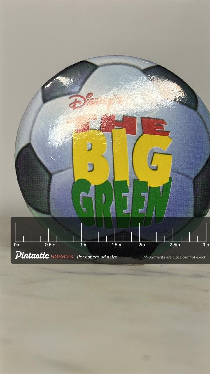 The Big Green Button Pin: Soccer Ball Design - 90s Disney Accessory with ruler overlay for size reference