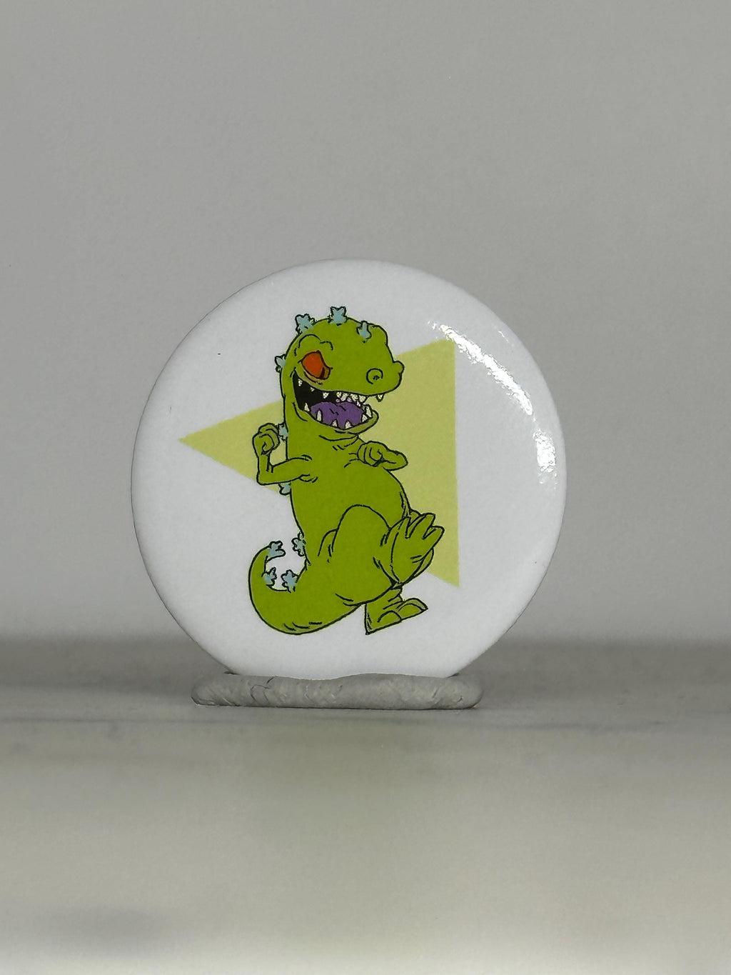 Vintage Reptar Button Pin: Glossy White Finish - 90s Nickelodeon Accessory