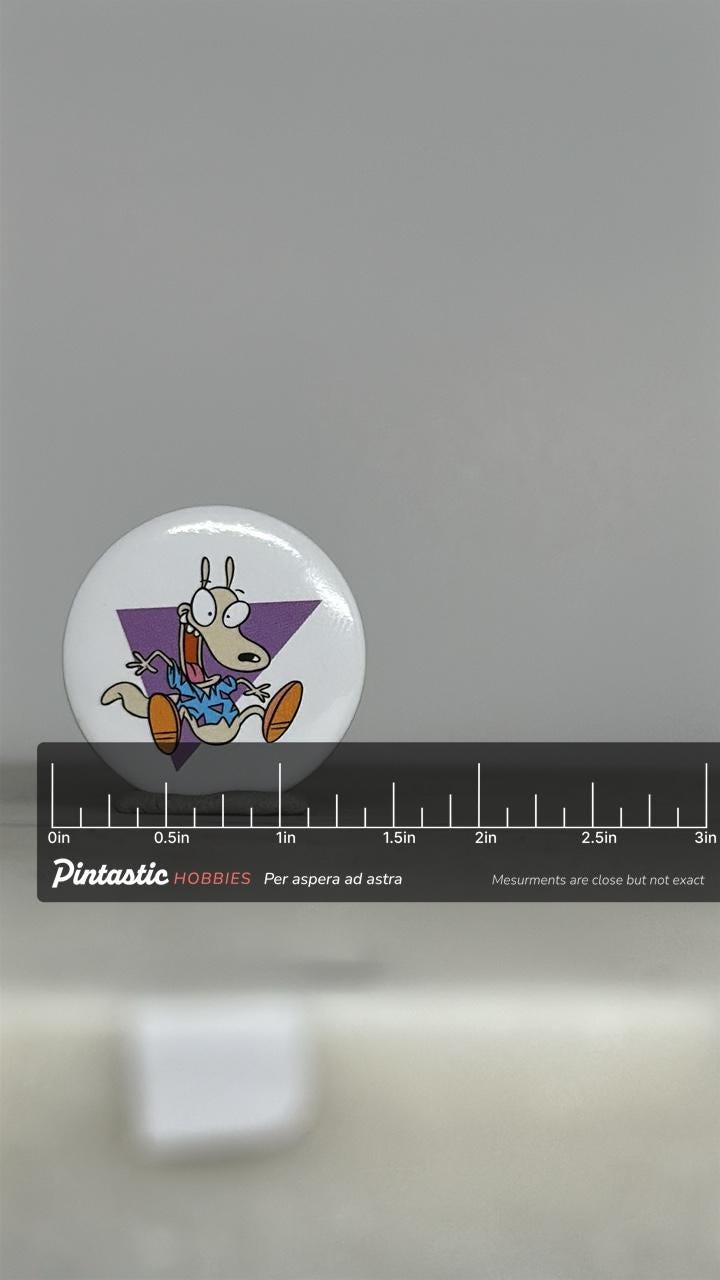 Vintage Rocko's Modern Life Button Pin: Bold Graphic - 90s Nickelodeon Accessory with ruler overlay for size reference