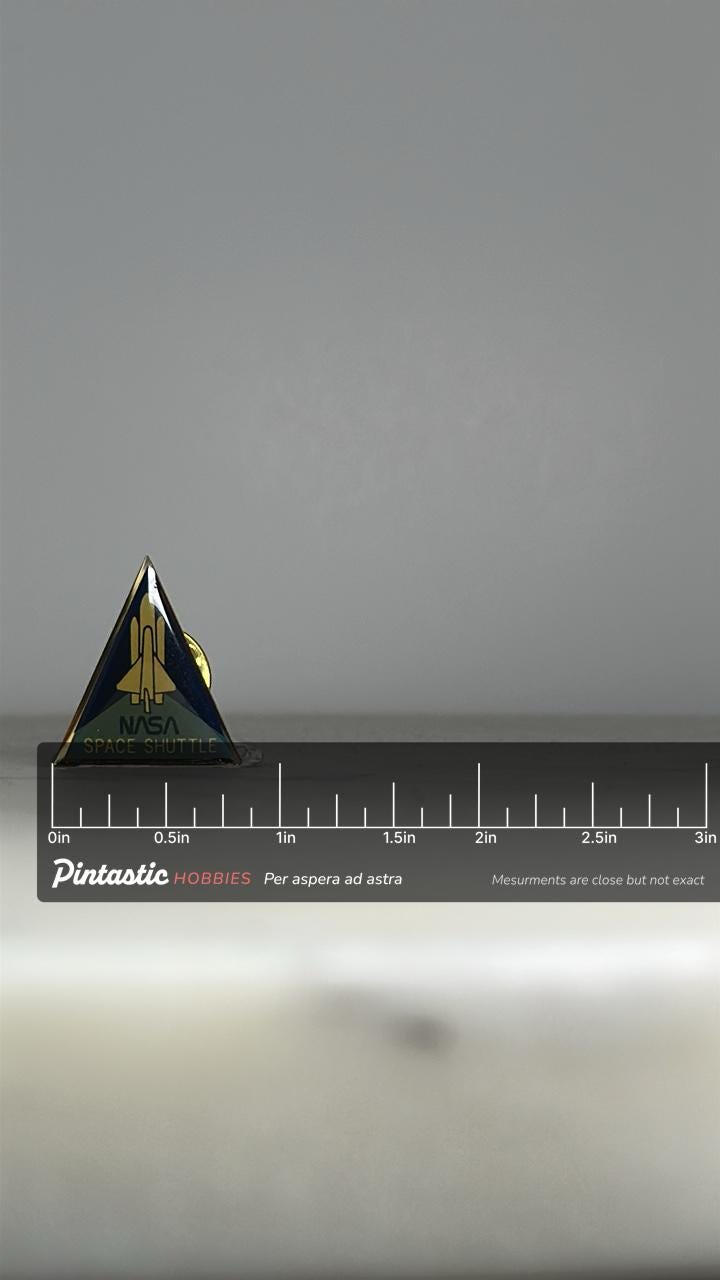 Vintage NASA Space Shuttle Enamel Pin: Triangular Gold-Tone - Retro Space Accessory with ruler overlay for size reference