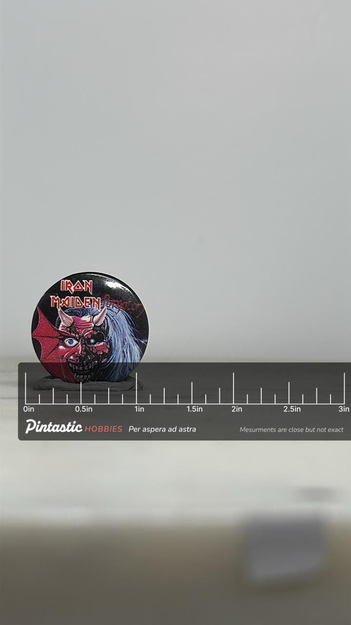 Iron Maiden Button Pin: Split Face Design - Vintage Metalhead Accessory with ruler overlay for size reference