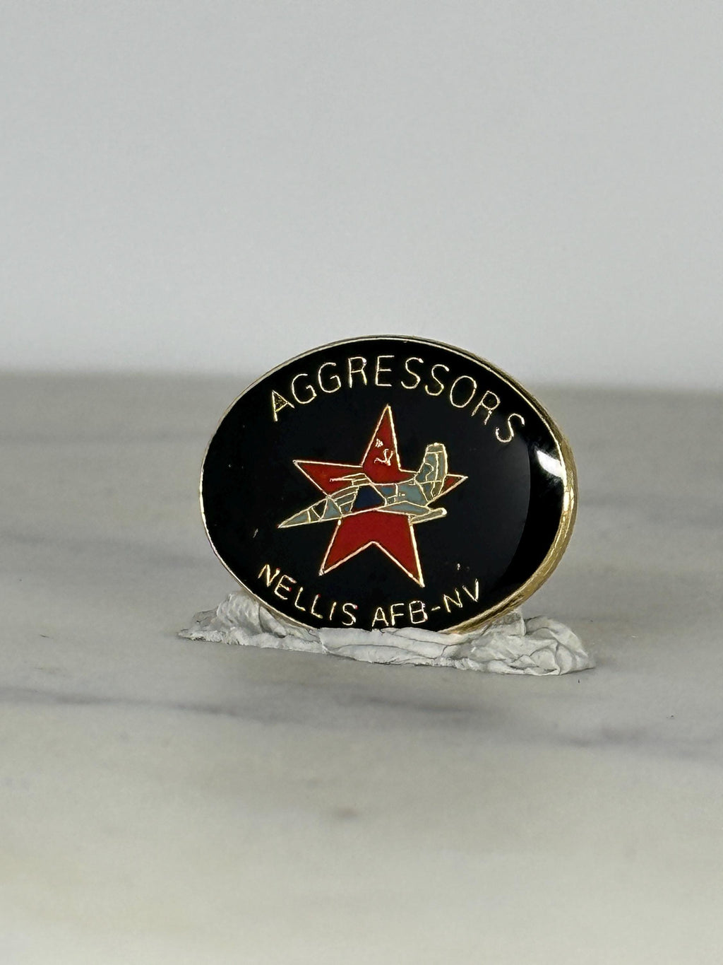 Nellis AFB Aggressors Pin: Black Enamel Oval - Military Collectible Accessory