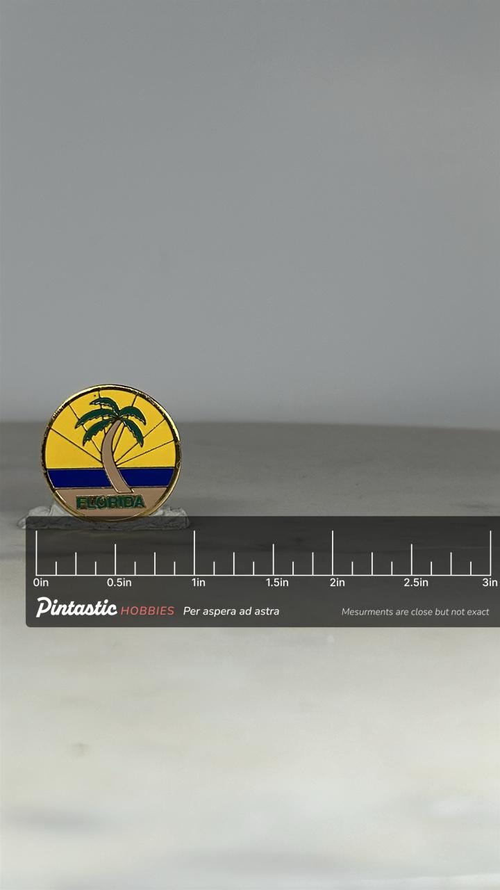 Florida Souvenir Enamel Pin: Yellow Palm Tree Design - Retro Travel Accessory with ruler overlay for size reference