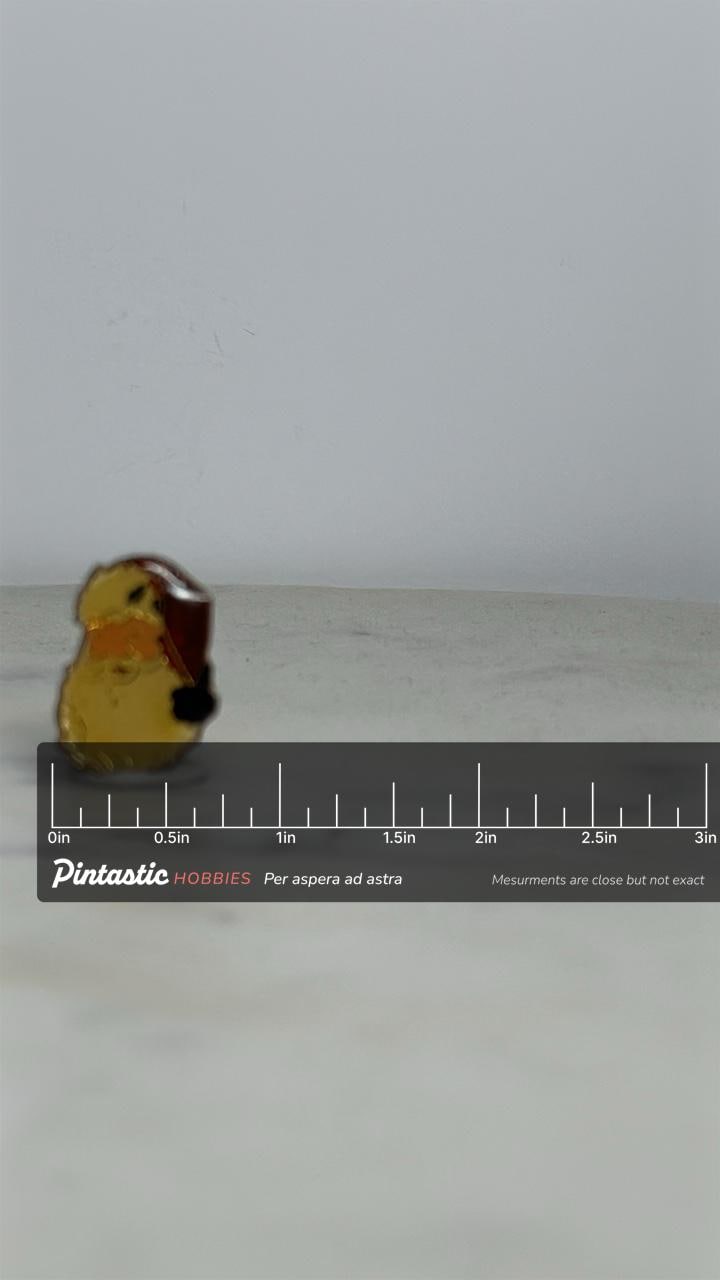 Santa Claus Enamel Pin: Goldtone Red Hat - Vintage Holiday Accessory with ruler overlay for size reference