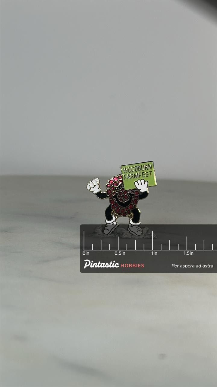 Woodburn Farmfest Enamel Pin: Dancing Berry Mascot - Retro Festival Accessory with ruler overlay for size reference