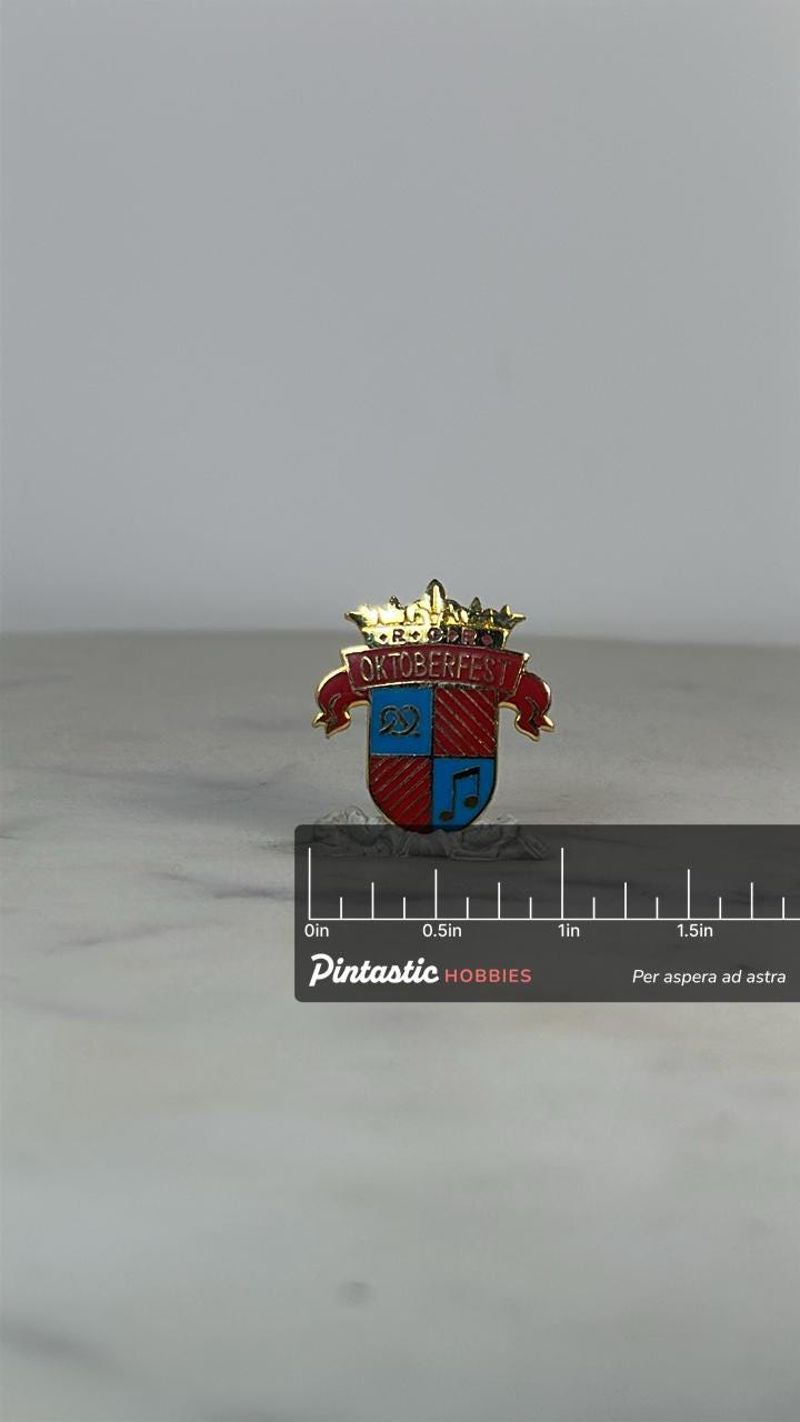 Oktoberfest Crest Enamel Pin: Red Gold Shield - Festive Bavarian Accessory with ruler overlay for size reference