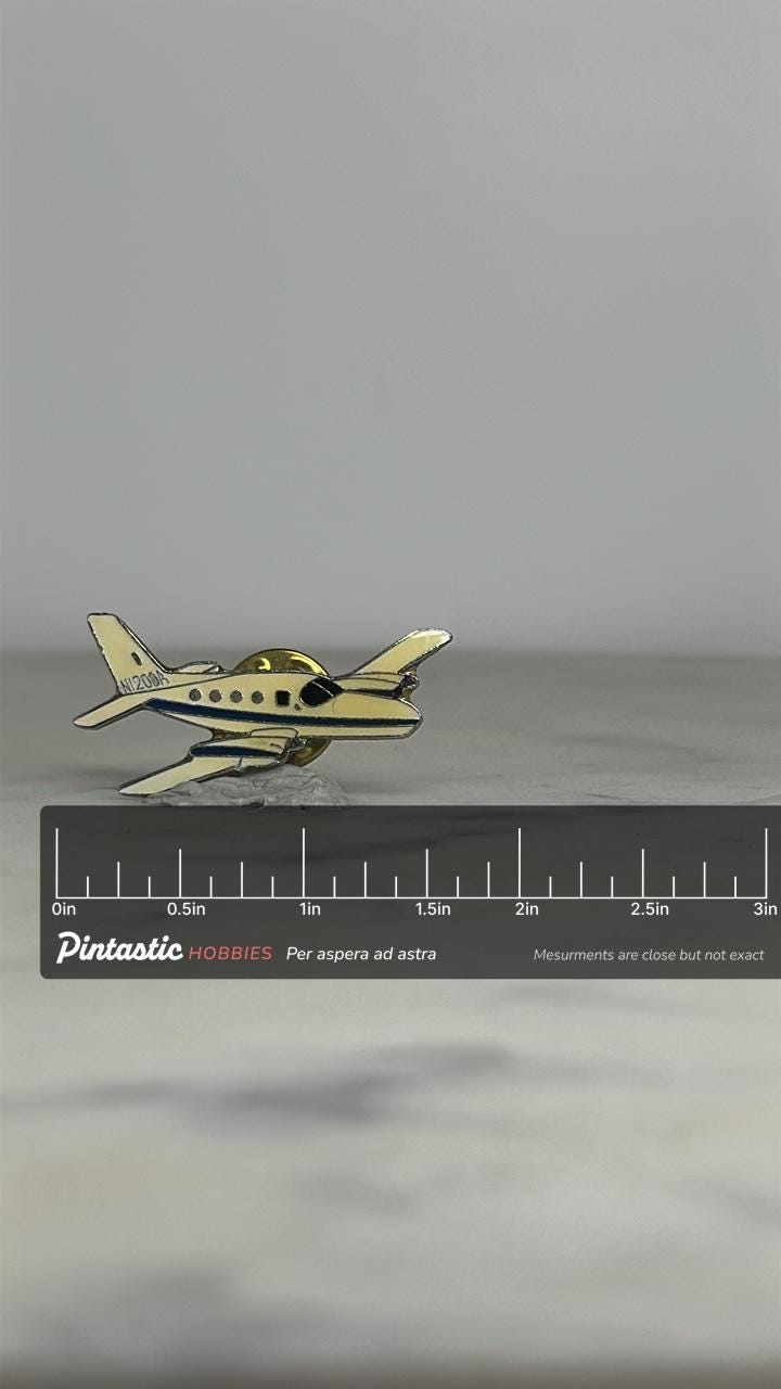 Cirrus Vision Jet Enamel Pin – N200 Series White & Blue Airplane Lapel with ruler overlay for size reference