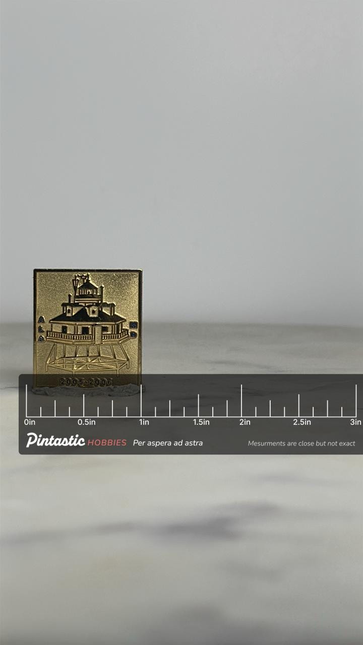 Lighthouse Souvenir Pin: Gold Finish Square - 2005-2006 Accessory with ruler overlay for size reference