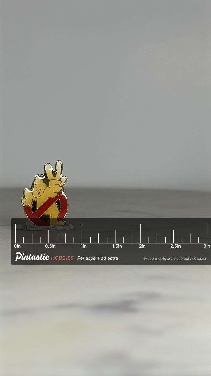 Ghostbusters II Enamel Pin: Red/Yellow/Gold Finish - 80s Movie Accessory with ruler overlay for size reference