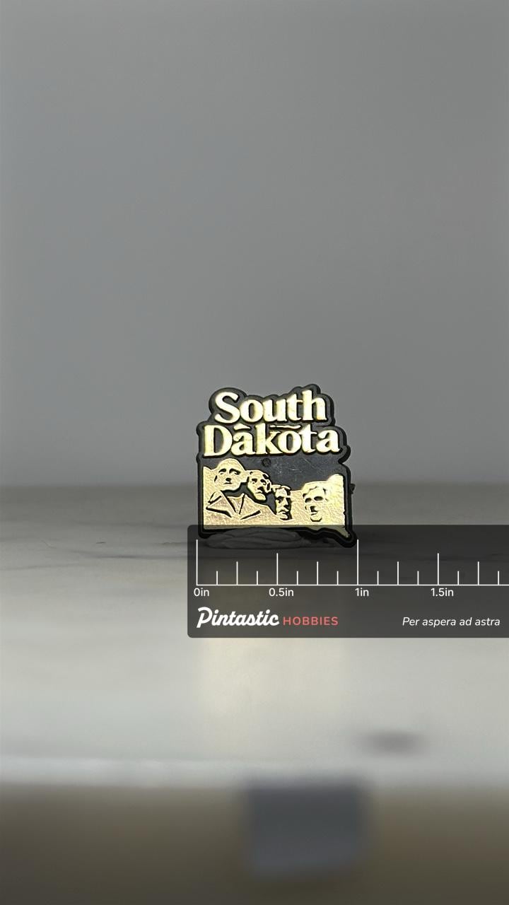 South Dakota Souvenir Pin: Gold Tone Enamel - Travel Collectible Accessory with ruler overlay for size reference