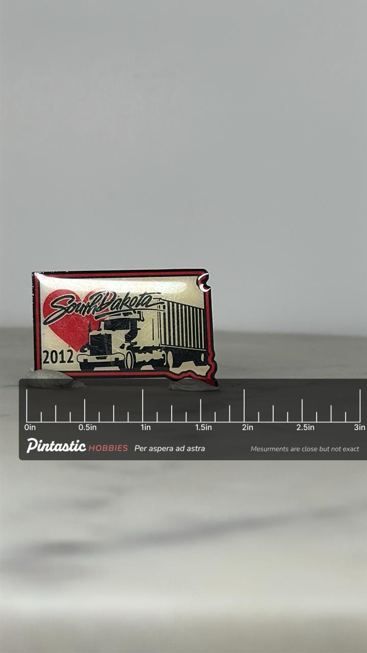 South Dakota Truck Enamel Pin: Red Black White - 2012 State Souvenir Accessory with ruler overlay for size reference
