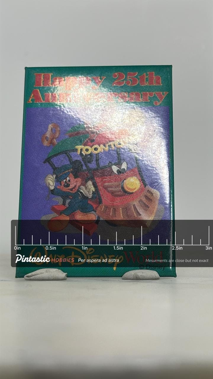 Mickey Mouse Toontown Pin: Colorful Metal - Disney 25th Anniversary Accessory with ruler overlay for size reference