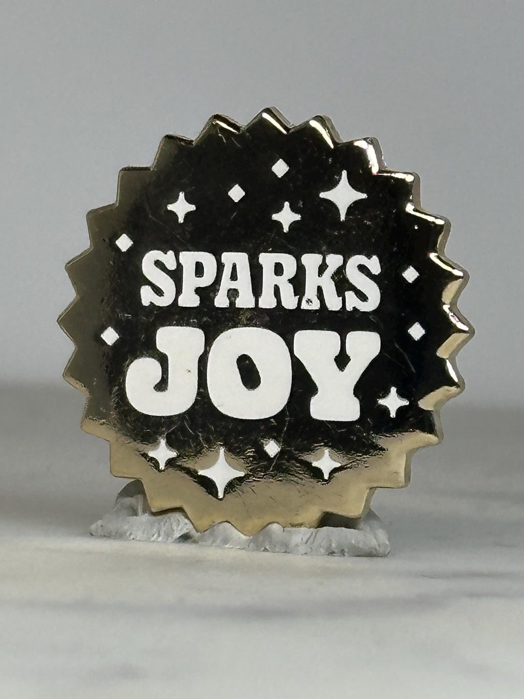 Sparks Joy Enamel Pin: Black & White Gold Starburst - Modern Positive Accessory
