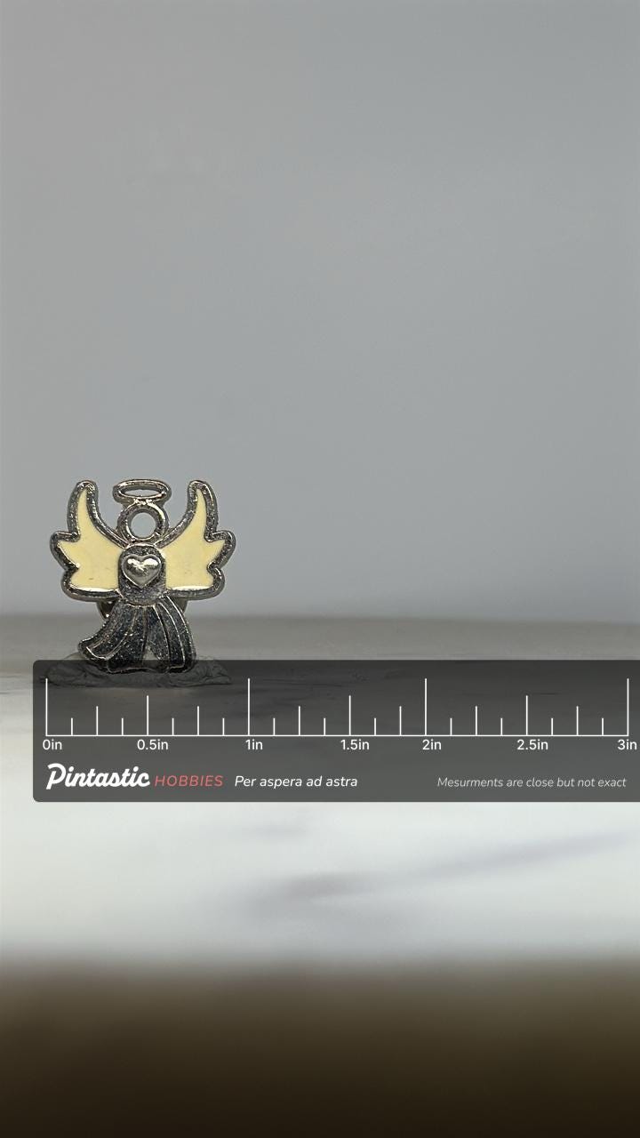 Angel Heart Enamel Pin: Silver & Cream Finish - Vintage Spiritual Accessory with ruler overlay for size reference
