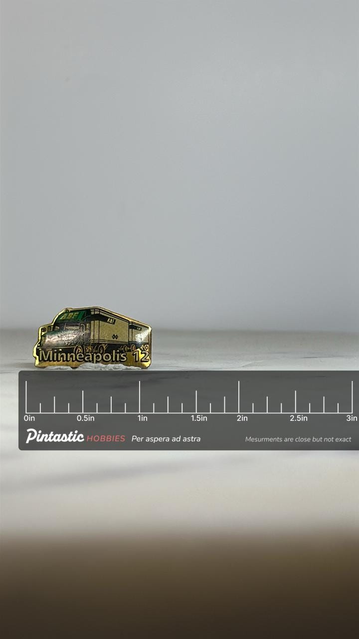 Minneapolis 12 Truck Enamel Pin: Green & Gold Finish - Vintage Transport Accessory with ruler overlay for size reference