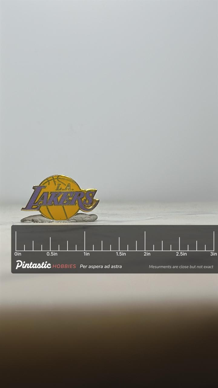L.A. Lakers Enamel Pin: Purple/Yellow Logo - Vintage Sports Accessory with ruler overlay for size reference