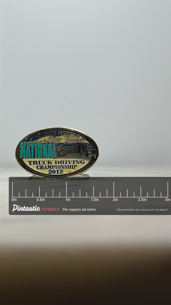 Truck Driving Championship Pin: Glitter Oval Enamel - 2012 Event Accessory with ruler overlay for size reference