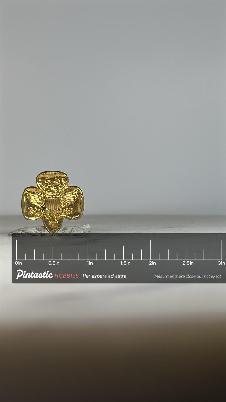 Girl Scouts USA Pin: Gold Tone Eagle Crest - Vintage Uniform Accessory with ruler overlay for size reference