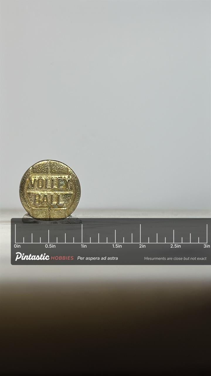 Volleyball Enamel Pin: Textured Gold Finish - Vintage Sport Accessory with ruler overlay for size reference