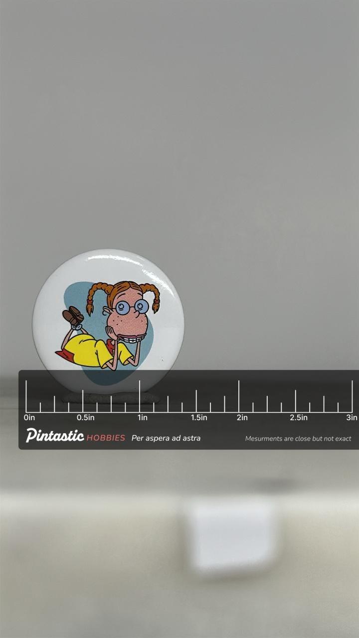Vintage Nickelodeon Eliza Thornberry Pin: Cartoon Button Style - 90s Nostalgia Accessory with ruler overlay for size referenc