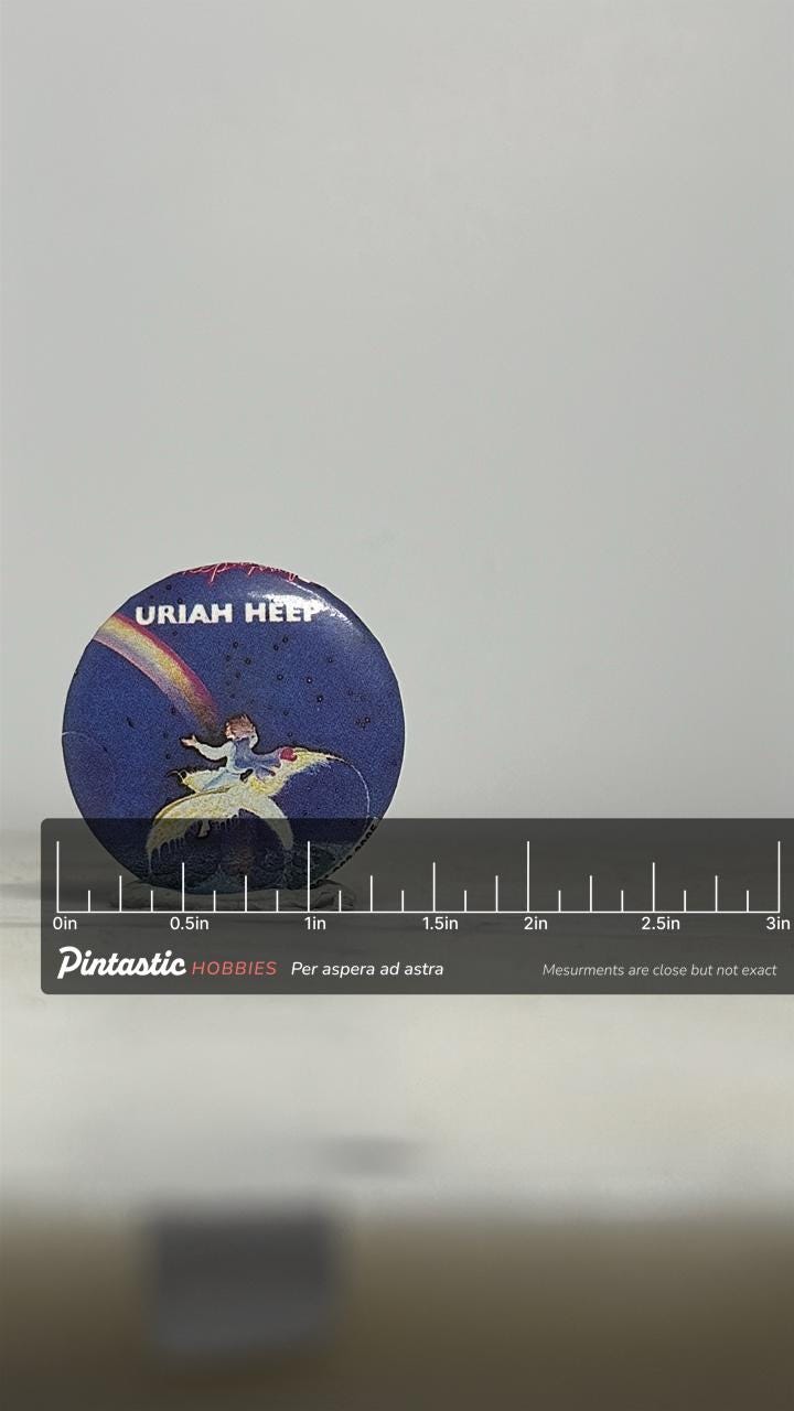 Uriah Heep Band Pin: Retro Album Art Style - 1970s Rock Accessory with ruler overlay for size reference