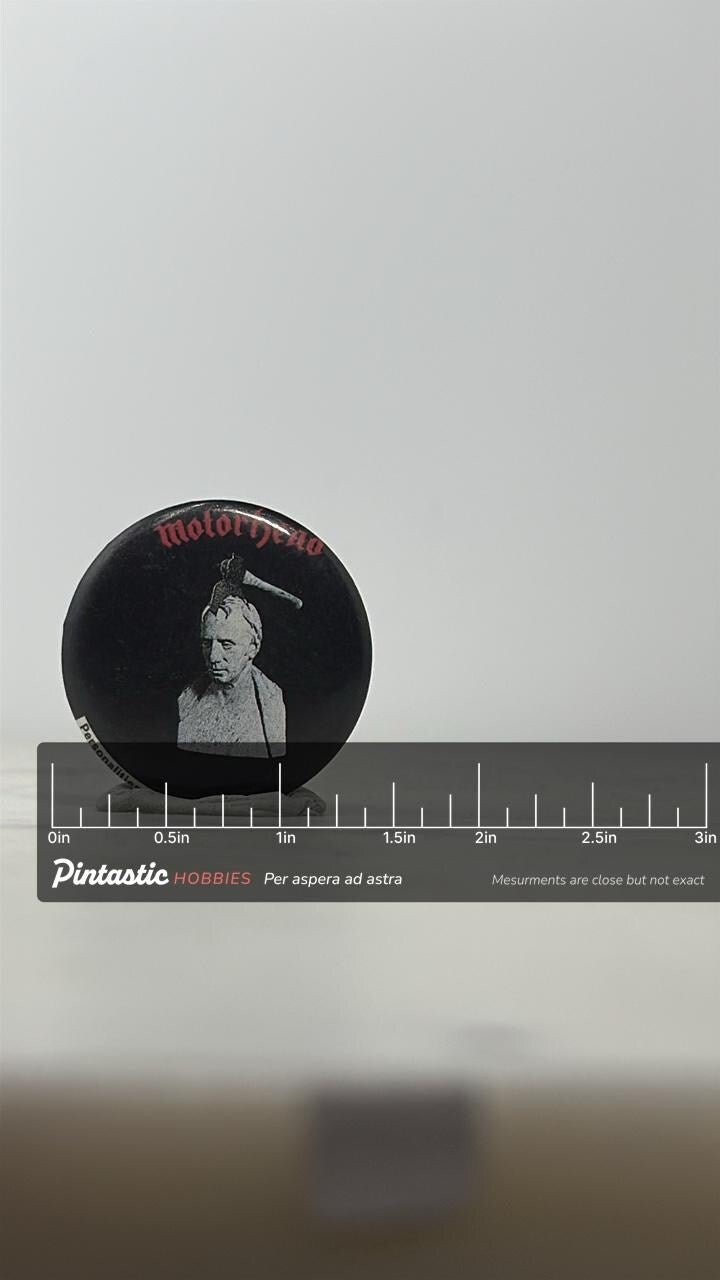 Motörhead Button Pin: Black & Red Graphic - Vintage Metalhead Accessory with ruler overlay for size reference