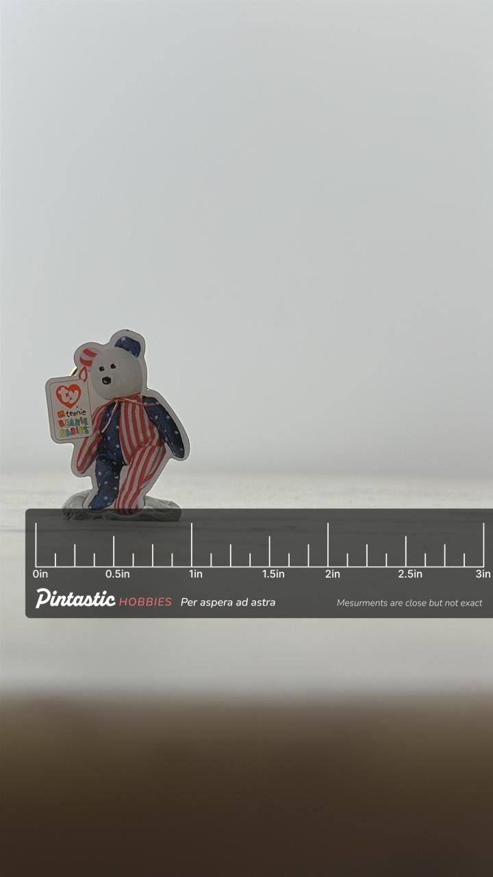 TY Teenie Beanie Bear Pin: Patriotic Star Stripes - 90s Collectible Accessory with ruler overlay for size reference