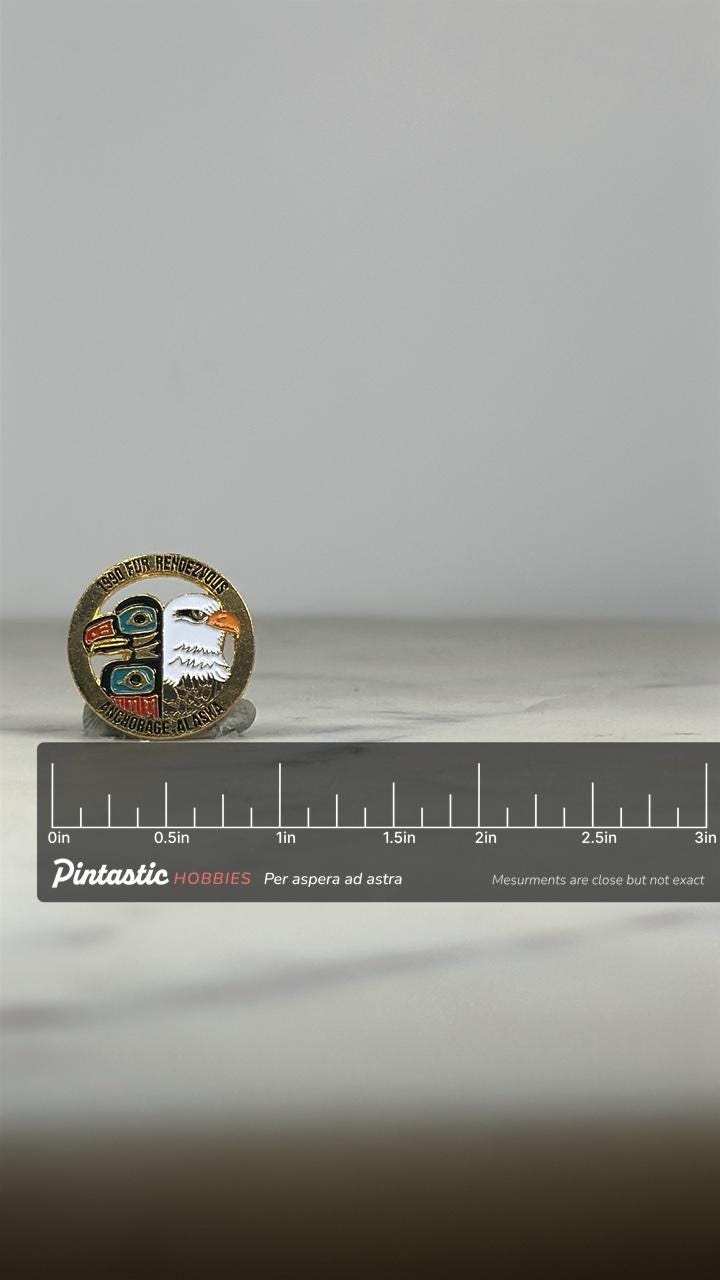 1990 Fur Rendezvous Enamel Pin: Gold Tone Tribal-Eagle - Alaska Souvenir Accessory with ruler overlay for size reference