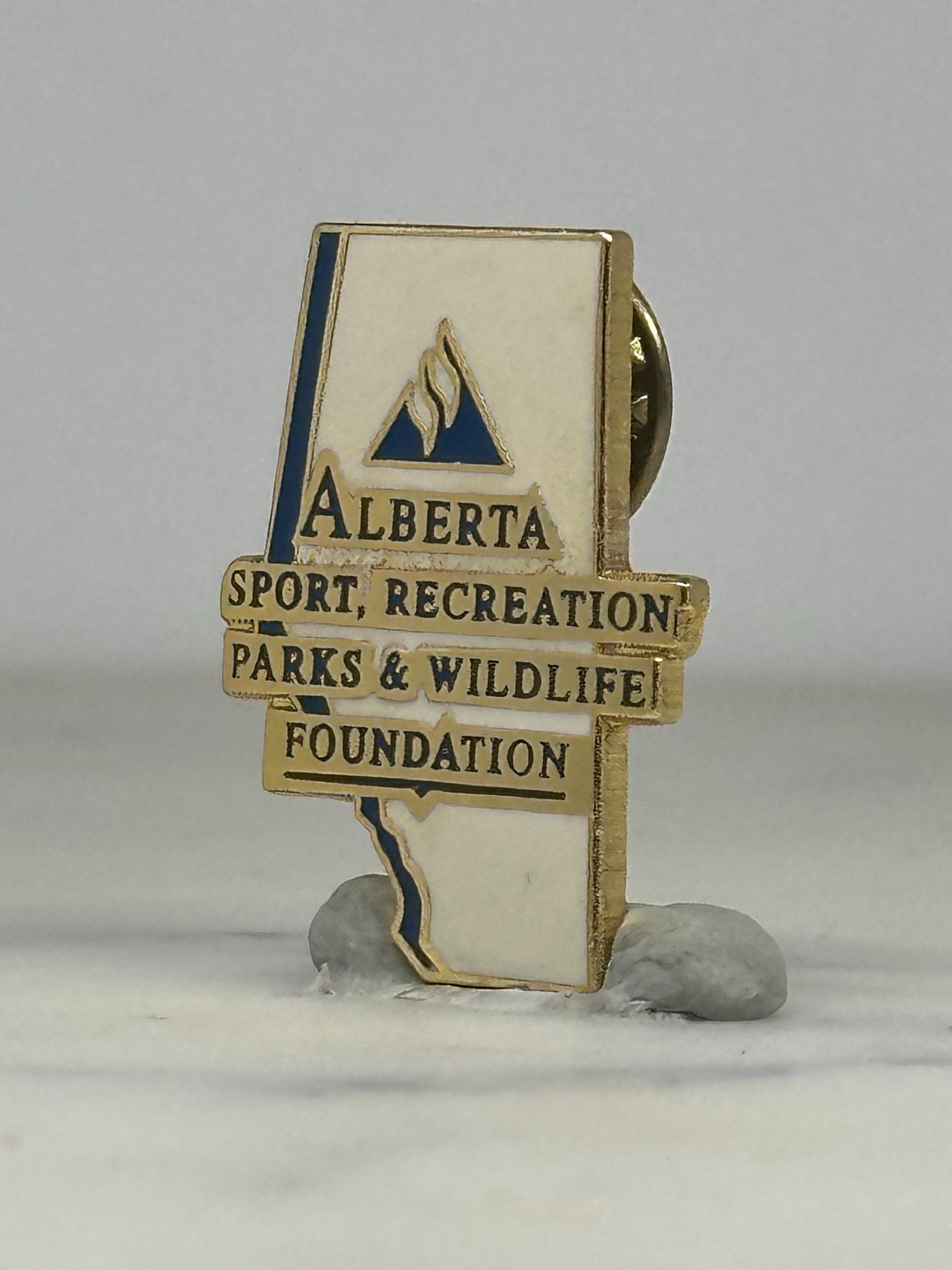 Alberta Foundation Enamel Pin: White & Blue Goldtone - Wildlife Org Accessory