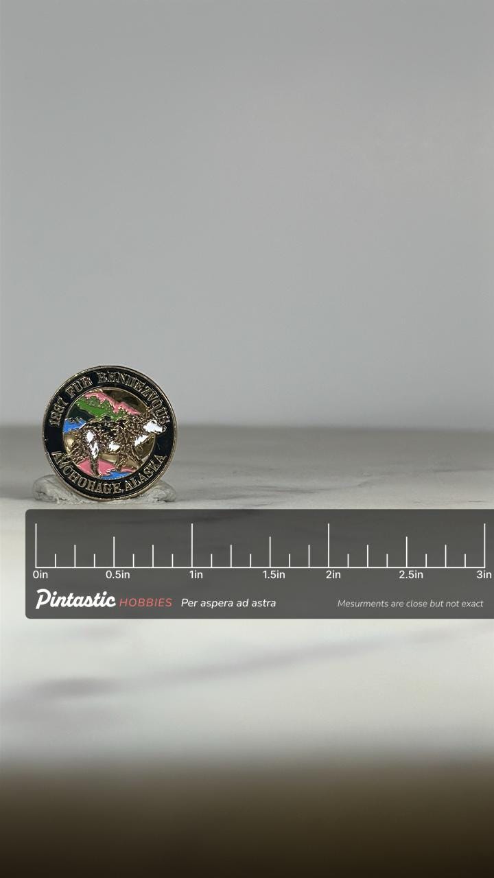 1987 Fur Rendezvous Enamel Pin: Multicolor Gold-Tone - Alaska Souvenir Accessory with ruler overlay for size reference