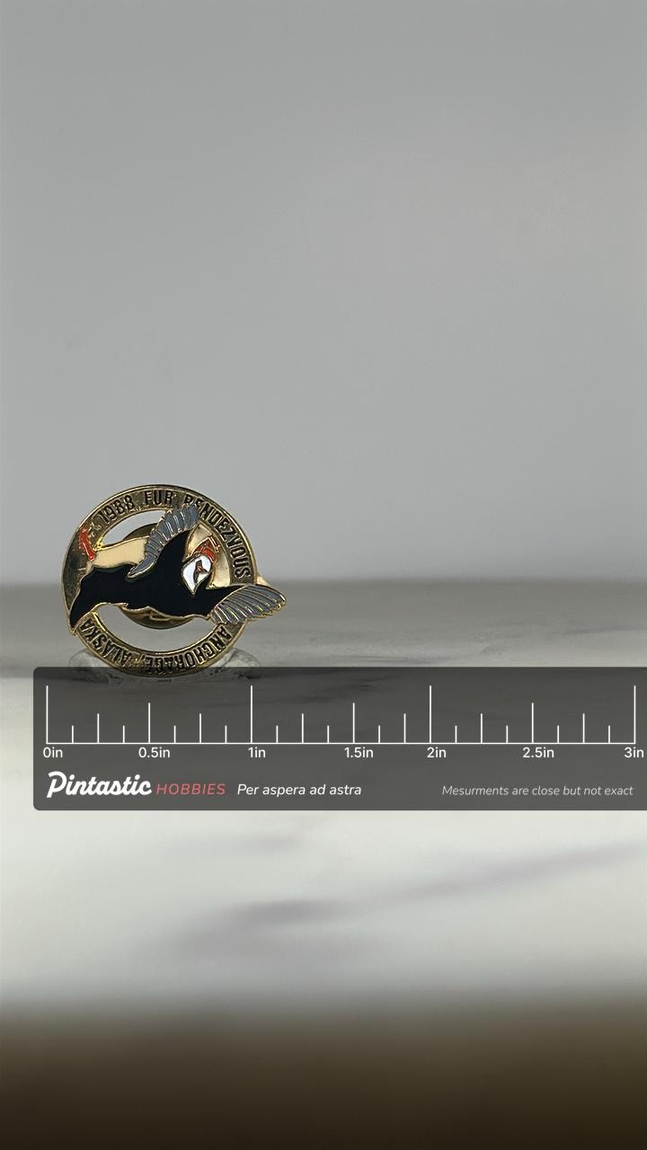 1988 Fur Rendezvous Puffin Pin: Gold & Enamel Finish - Alaska Festival Accessory with ruler overlay for size reference