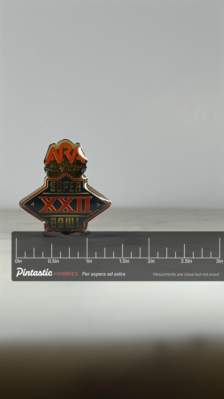 Super Bowl XXII Enamel Pin: Red & Gold Logo - 1980s Sports Accessory with ruler overlay for size reference