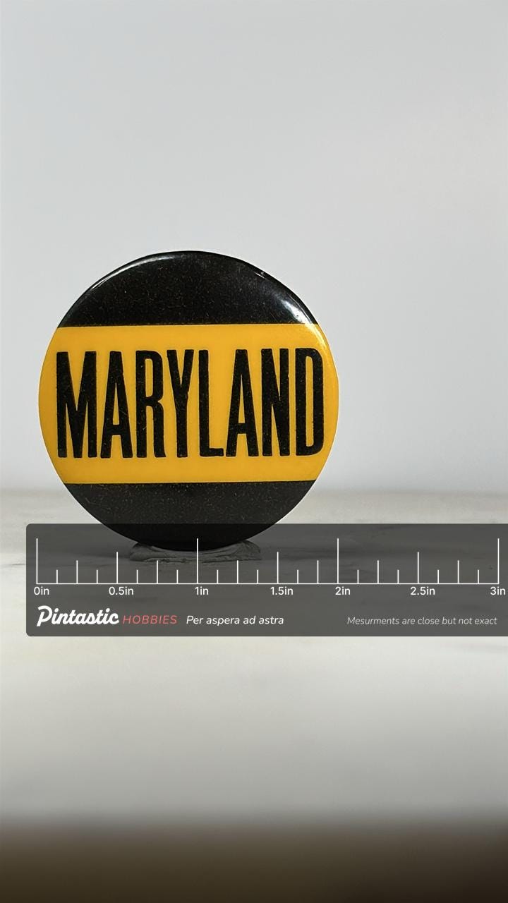 University of Maryland Button Pin: Yellow & Black Text - Vintage College Accessory with ruler overlay for size reference