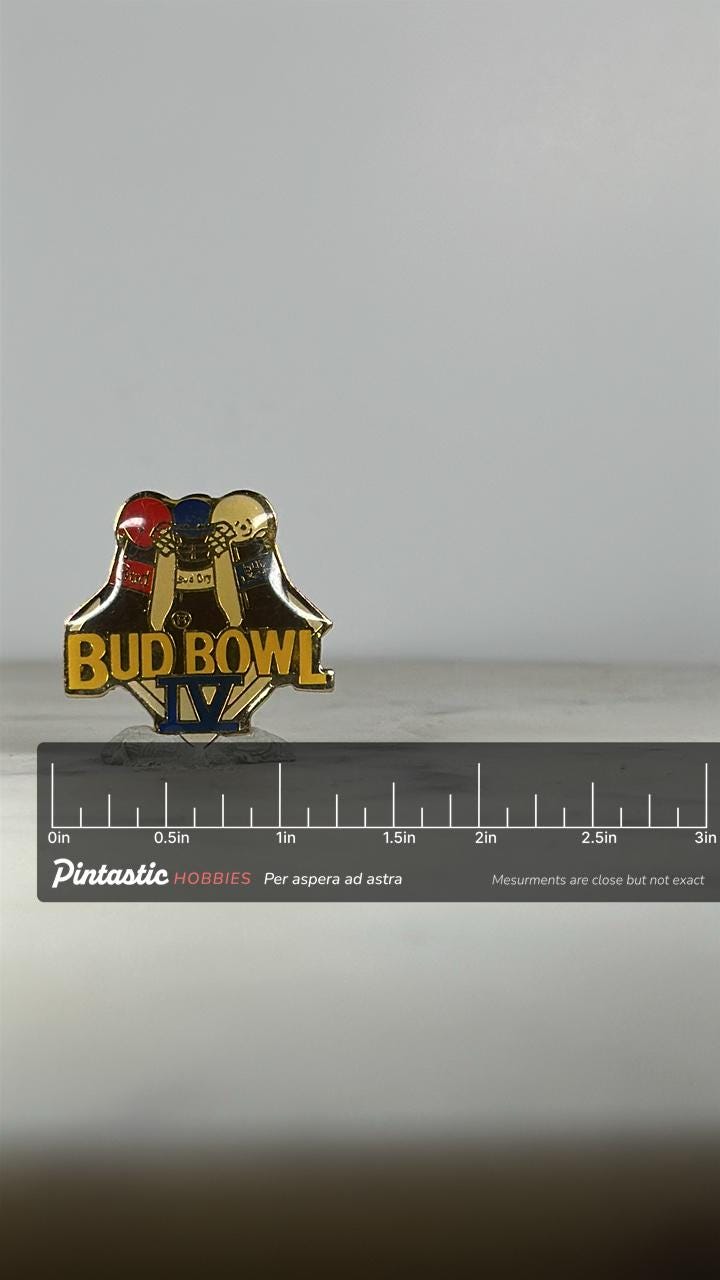 Bud Bowl IV Enamel Pin: Red/Blue/Gold Finish - 1990s Sports Accessory with ruler overlay for size reference