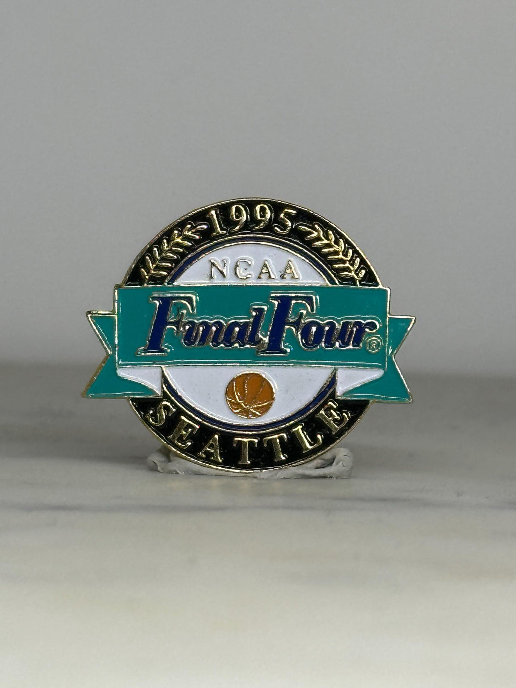 NCAA Final Four Enamel Pin: Teal/Gold Finish - 1995 Seattle Accessory