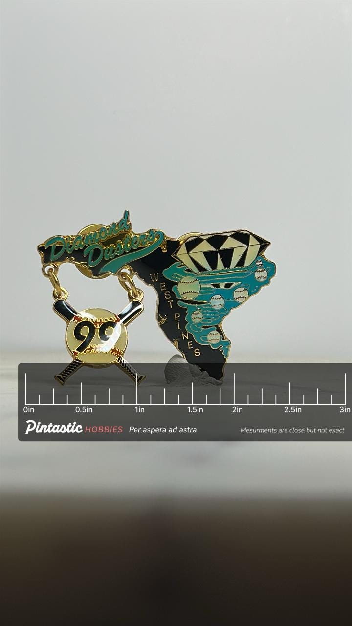 Diamond Dusters Baseball Pin: Black & Teal Enamel - 1990s Sports Accessory with ruler overlay for size reference