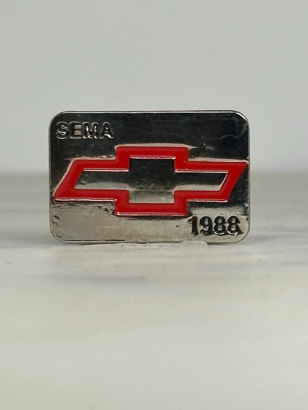 Chevy SEMA Enamel Pin: Red Logo on Silver - 1988 Auto Show Accessory