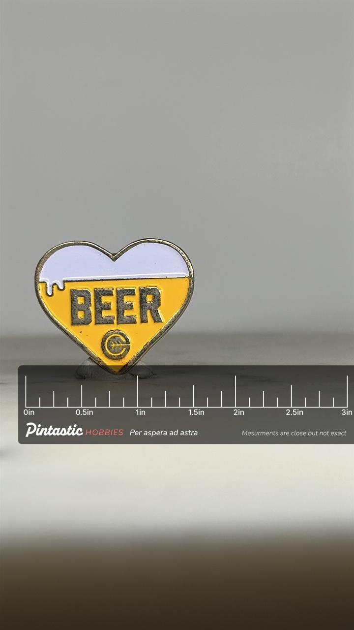 Beer Heart Enamel Pin: Yellow & White Metal - Retro Bar Accessory with ruler overlay for size reference