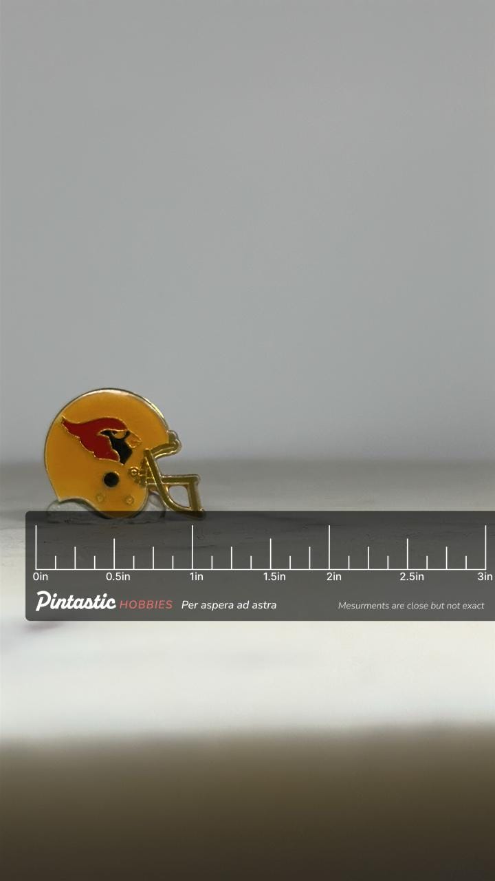 Cardinals Football Helmet Pin: Yellow Enamel Gold Trim - Vintage Sports Accessory with ruler overlay for size reference