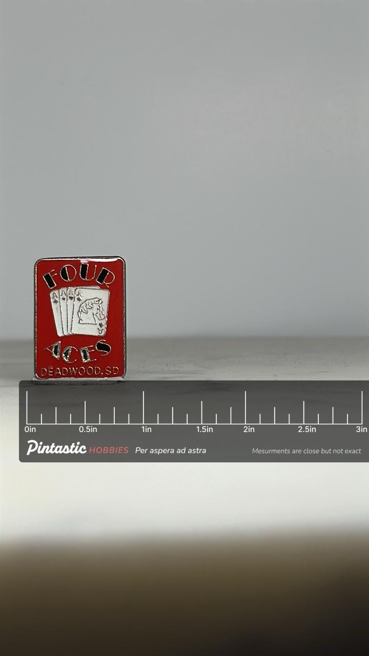 Four Aces Casino Pin: Red Enamel Souvenir - Vintage Deadwood Accessory with ruler overlay for size reference