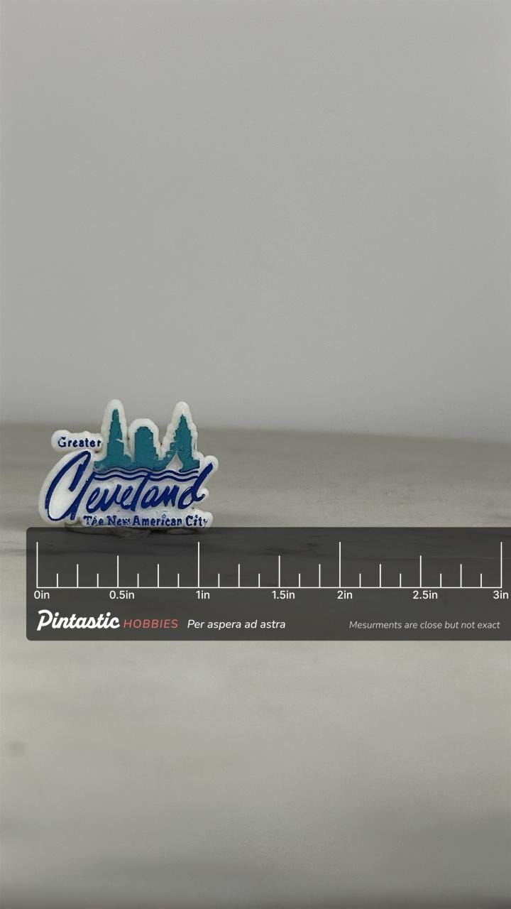 Cleveland Skyline Enamel Pin: White & Blue - 1980s City Souvenir Accessory with ruler overlay for size reference